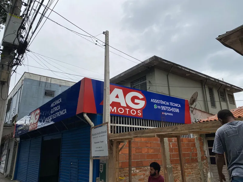 Fachada com logo em PVC 10mm e adesivo recortado para a assistência técnica AG Motos — Cromatica Comunicação Visual, Santos/SP