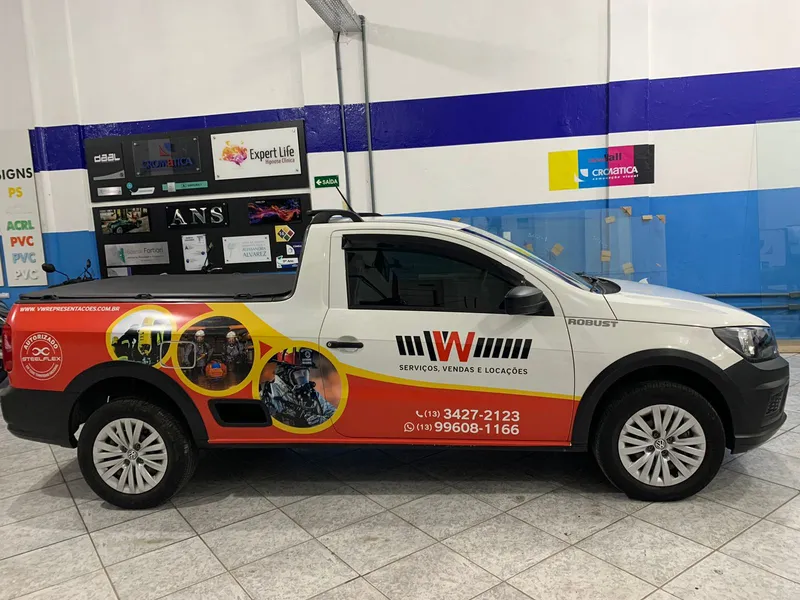 VW Saveiro com adesivo digital para empresa de venda e locação de equipamentos de segurança — Cromatica Comunicação Visual, Santos/SP